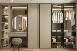 a-walk-in-closet-with-a-mirror-and-a-stool.jpg a walk in closet with a mirror and a stool